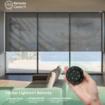 Motorized coupled roller shades with 3% openness greyish black fabric and remote control