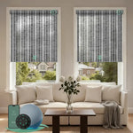 V jungle dark grey motorised  light filtering roller blinds in a bright living room, providing soft natural light and daytime privacy