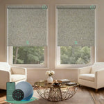 Motorised blockout roller blinds from the V-Series in v caramel gold, providing full light blackout and smart control for a calm living room