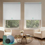 Motorised blockout roller blinds from the V-Series in V-Shimmer White, providing full light blackout and smart control for a calm living room