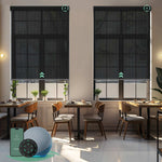 Motorised sunscreen roller blinds with 3% openness in black fabric, filtering daylight while maintaining outdoor views and privacy