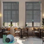 Motorised sunscreen roller blinds with 3% openness in greyish black fabric, filtering daylight while maintaining outdoor views and privacy