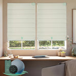 Motorised blockout roman blinds in woven beige fabric, providing full light blocking and privacy, ideal for bedrooms and smart home control.